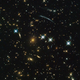 Hubble image of galaxy clusters and stars, including the PLCK G004.5-19.5 cluster discovered by Planck.